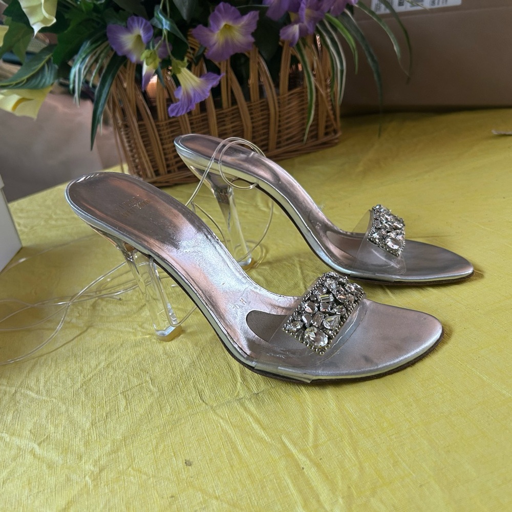 Stuart Weitzman silver heels.